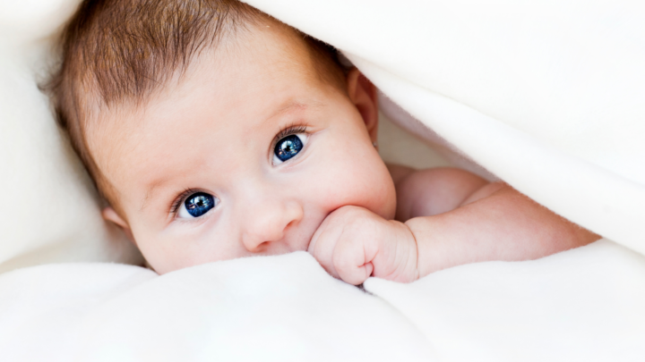 Baby in bedsheet