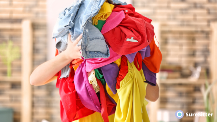 Woman holding bundle of clothes